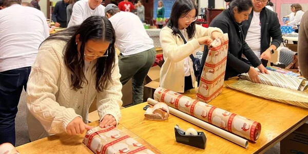 team wrapping presents