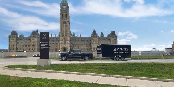 Inflector truck in front of Canadian Parliament Buildings