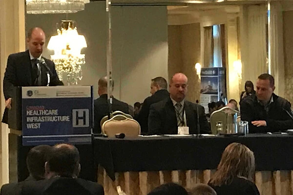Egidio Mosca onstage, to discuss procurement models, at Canadian Healthcare Infrastructure West
