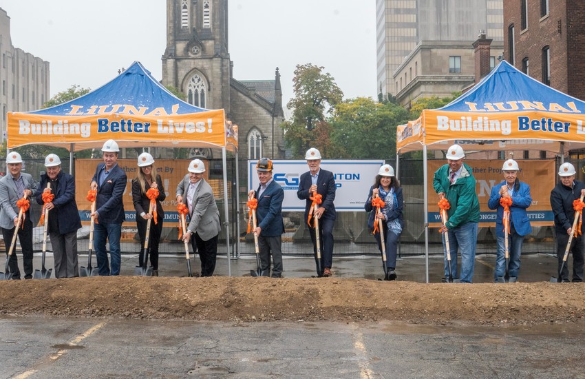 Eleven attendees with shovel at 75 James groundbreaking event